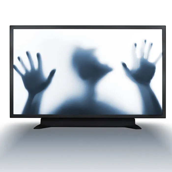 A person trying to break through a computer screen