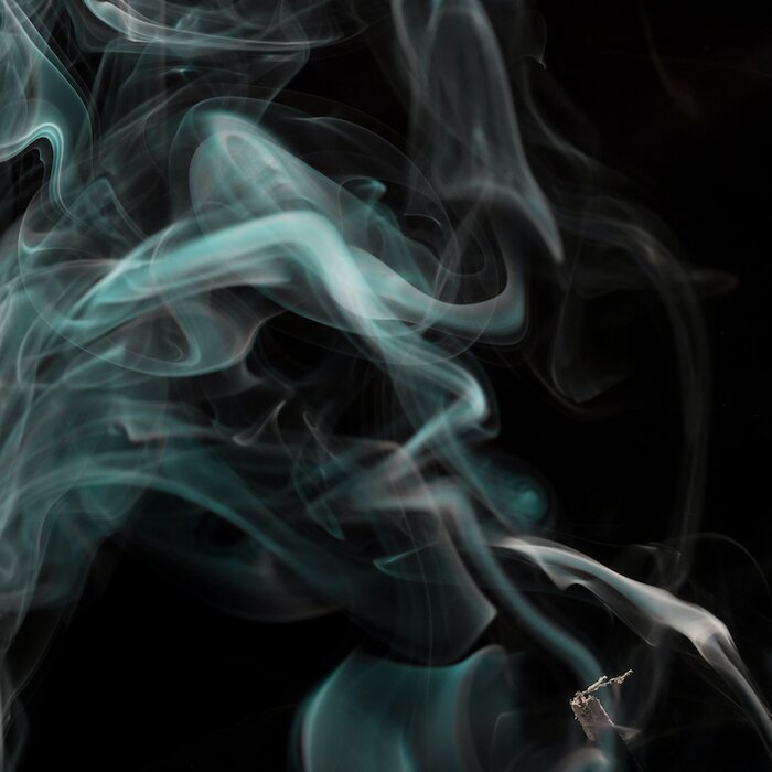 Smoke plumes with the vague image of a face