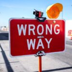 A street sign saying "Wrong Way"