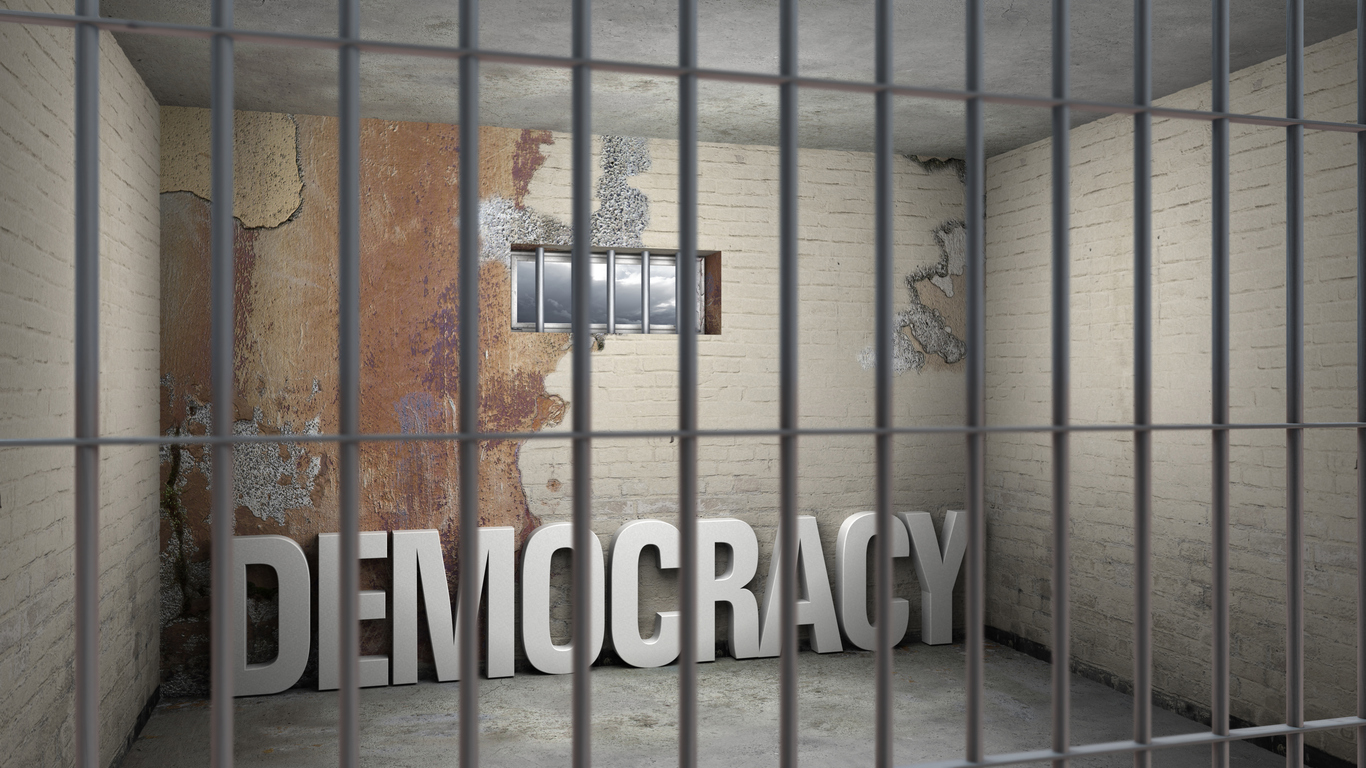 The word "democracy" behind prison bars